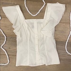 White buttoned ruffled shirt